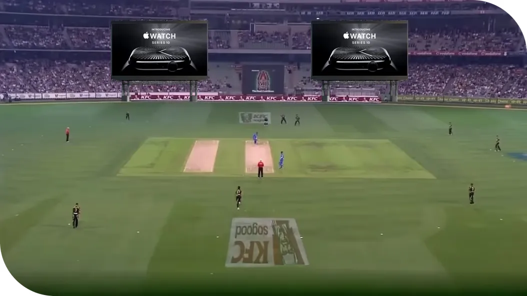 A cricket stadium with the ad rendered in-scene on the venue's giant screens
